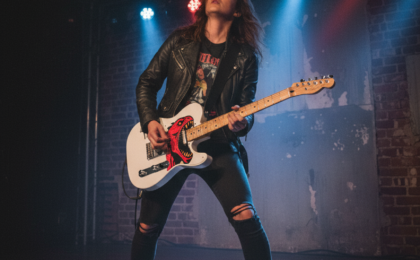 Guitarist with a distinctive FirstlyMusic custom visual Telecaster pickguard